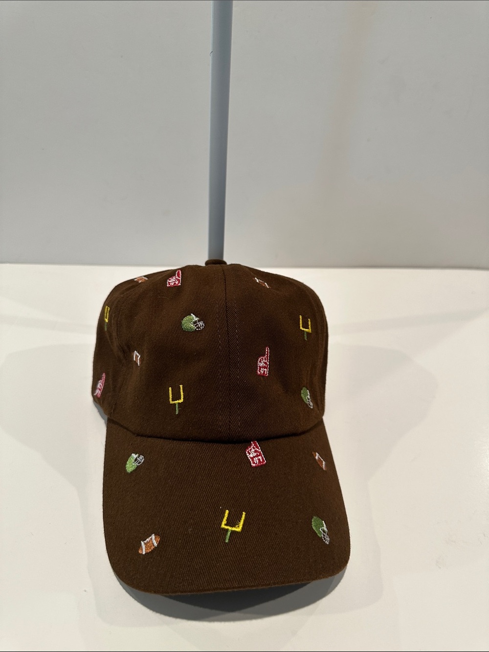 NWT Marcus Adler Ladies Brown Patterned Baseball Cap with adjustable back.